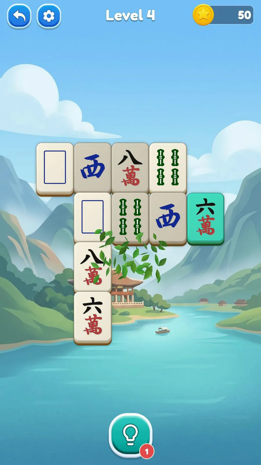 Two matching tiles clearing with a leaf effect on a Mahjong Solitaire board.